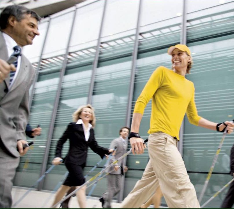 Nordic Pole Walking for Groups guy in yellow shirt Nordic Pole Walking for Groups guy in yellow shirt