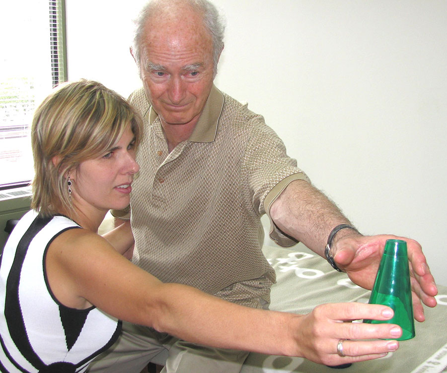 Neuro-Rehabilitation services: man grabbing cone