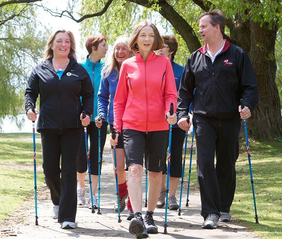 Nordic Pole Walking for Groups group in forest