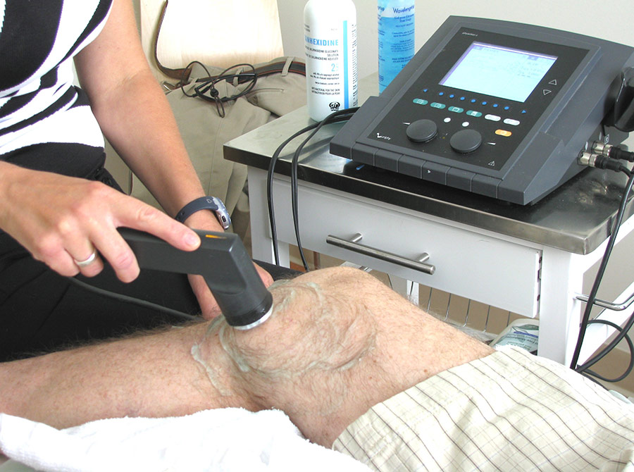 Physiotherapy-services patient with ultrasound machine